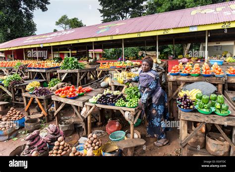 A woman selling vegetables on a street market, Kampala, Uganda Stock ...