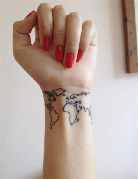 Small size dark black ink world map contour tattoo on wrist ...