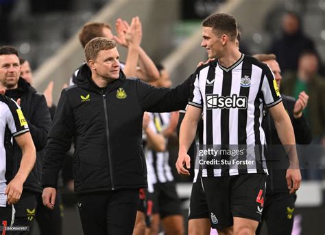 Newcastle head coach Eddie Howe chats with Sven Botman after the ...