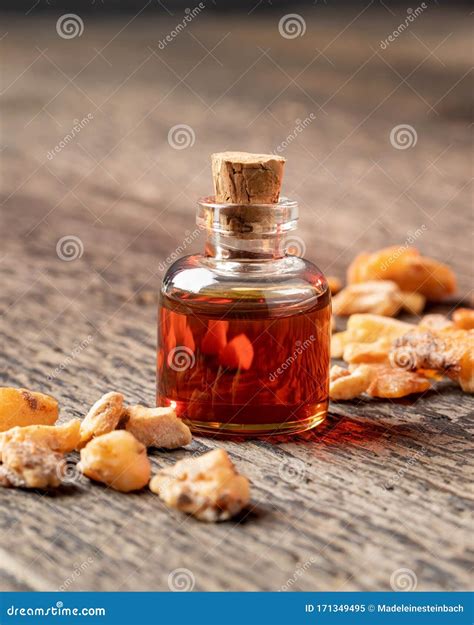 A Bottle of Styrax Benzoin Essential Oil with Benzoin Resin Stock Image ...