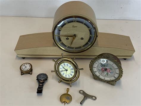 At Auction: Collection of items incl, German made Urgos mantle clock ...