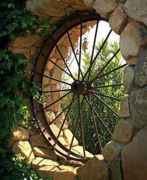 The 25+ best Wagon wheel garden ideas on Pinterest | Old wagons, Garden ...