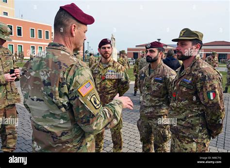 Command Sgt. Maj. Franklin Velez of the 173rd Airborne Brigade (left ...