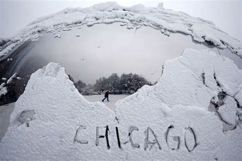 Blizzard hits north-eastern US: People dig cars out of deep snow in ...