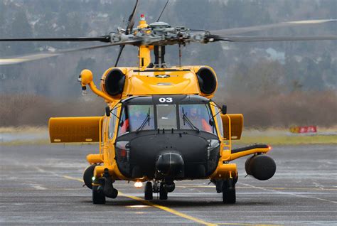 US Coast Guard MH-60 Jayhawk helicopter with a yellow paint scheme