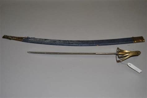 Curved sword with brass hilt and a scabbard, marked made in