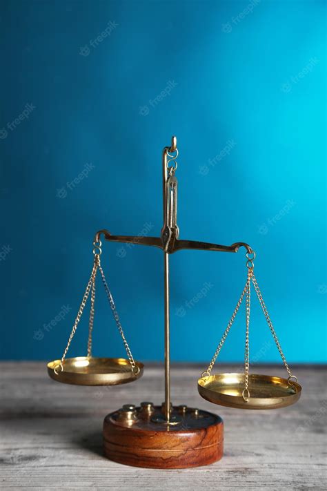 Premium Photo | Justice scales on blue background