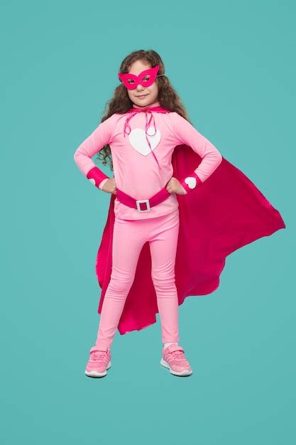 Premium Photo | Confident youngster in pink superhero costume