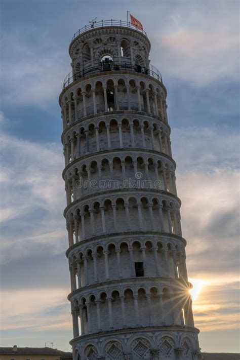 Vertical View of the Leaning Tower of Pisa at Sunset with a Sunburst ...