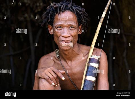 Bushmen of the San people hunting with a bow, Kalahari, Namibia, Africa ...