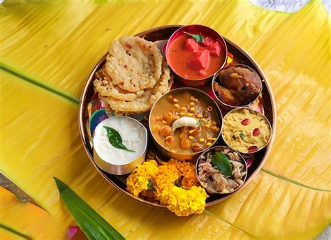 Premium Photo | Onam feast eating onasadya in banana leaf during the ...