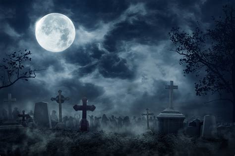 Zombie Rising Out Of A Graveyard Cemetery In Spooky Dark Night Stock ...