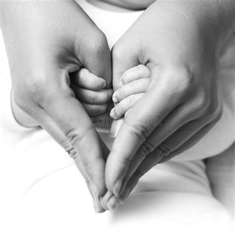 Baby holding mother hand stock image. Image of childhood - 24941815