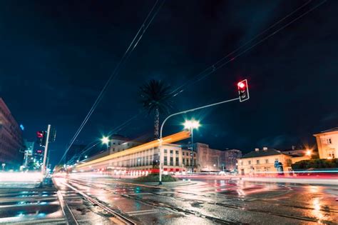 Premium Photo | Light trails of tram in the city at night