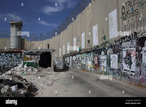 Political graffiti painted on the Palestinian side of the Wall of ...