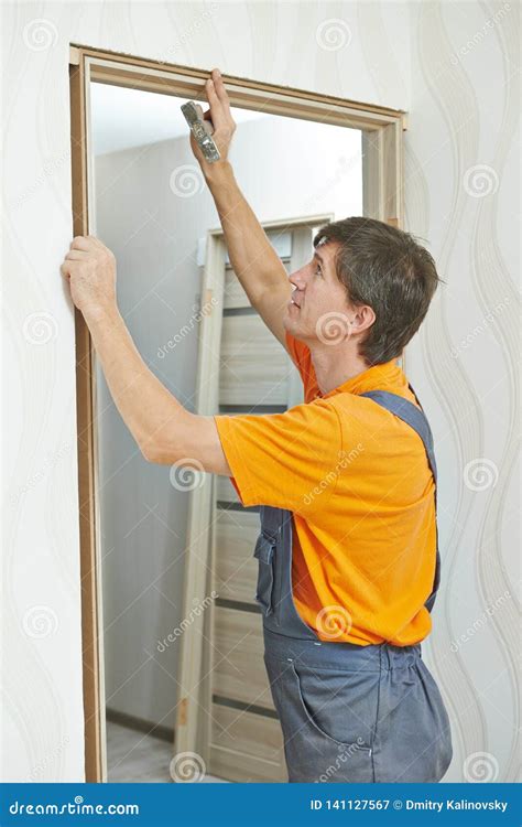 Door Frame Installation. Carpenter Works with Drill Stock Image - Image ...