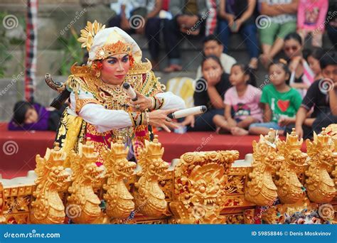 Balinese Man Dancing and Playing Music on Gamelan Gong Editorial Photo ...