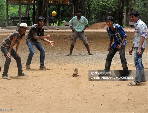 School students play a game of 'lagori' in Mumbai on May 29, 2012 ...