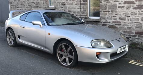 This stock-ish [Toyota Supra mk4] lives nearby, and only moves every ...