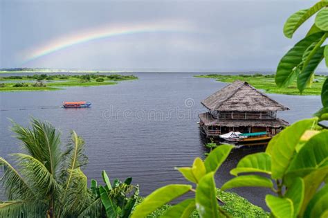 View of the Amazon River Tributary in Iquitos, Peru. a Rainbow Over the ...