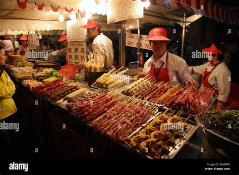 Food stall at a Night Market in Beijing China Stock Photo - Alamy