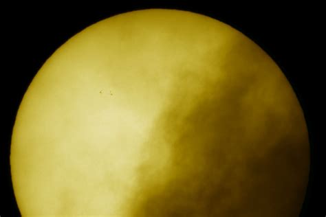 APOD: 2009 June 4 - Sunspots on a Cloudy Day