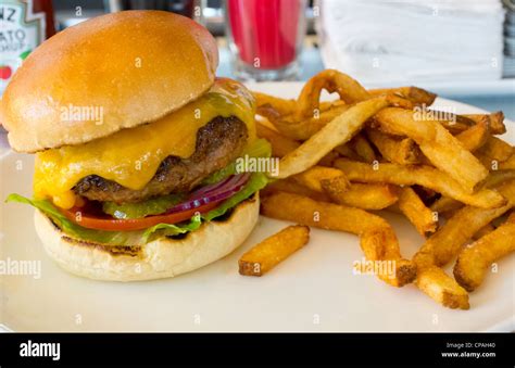 Cheeseburger and fries Stock Photo - Alamy