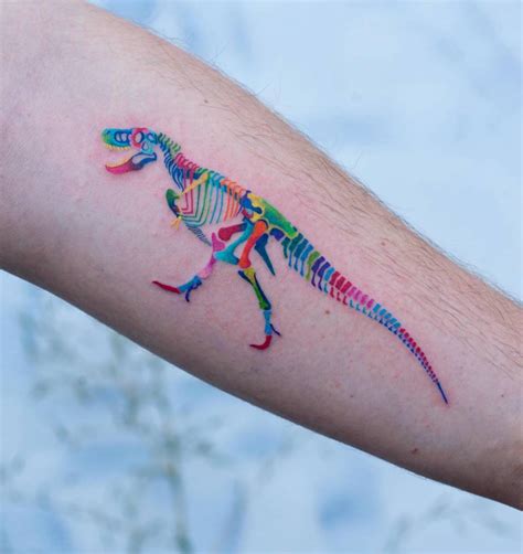 T-Rex skeleton tattoo located on the inner forearm,