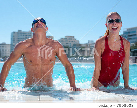 Young couple exiting swimming pool 7908008