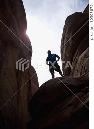 Man atop Red Rock Arches National Park Moab Utah USA 10503679