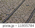 old tram rails on cobblestone 11935784