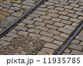 old tram rails on cobblestone 11935785