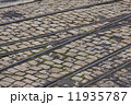 old tram rails on cobblestone 11935787