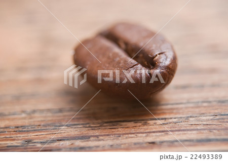 closeup of coffee bean on wooden background 22493389