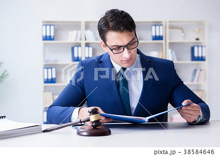 Young lawyer judge sitting in the office 38584646