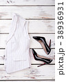 Women classic waistcoat and black stilettos. 38936931