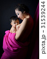 asian mother holding and breast feeding her baby 31539244