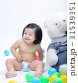 asian baby girl smiling and sitting colorful ball 31539351