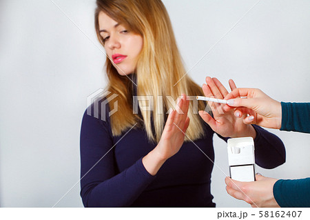 Closeup Of Woman Giving Up Smoking Cigarettes. Health Concept 58162407