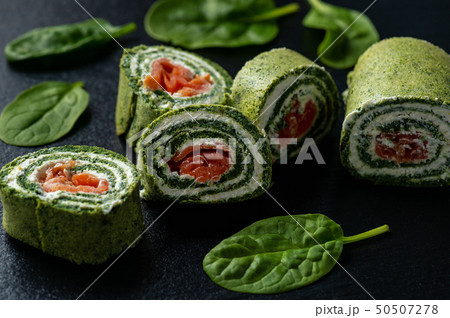 Spinach rolls with smoked salmon and cream cheese. 50507278