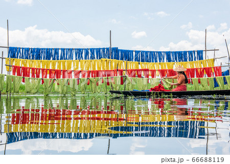 Burmese dry thread the Handmade colourful lotus fabrics at Inle Lake, Shan State in Myanmar. 66688119