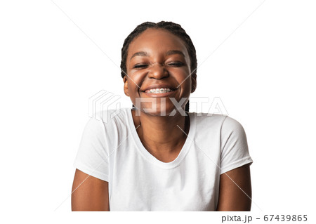 Happy African American Woman Smiling With Eyes Closed, White Background 67439865