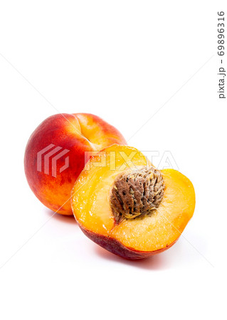 Ripe peach fruit and a half isolated on white background. 69896316