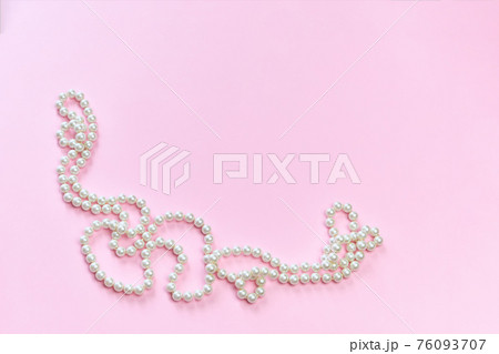 Feminine desktop mockup with pearls on pink background with copy space. 76093707