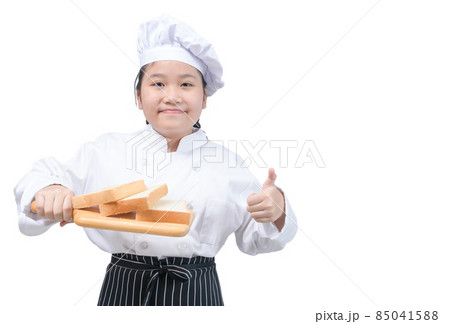 Portrait of a professional girl chef show bread on wood plate isolated 85041588