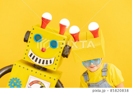 Happy child playing with robot 85820838