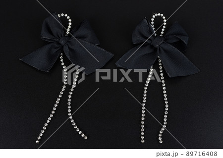 Jewelry earrings and costume jewelry on a black background 89716408