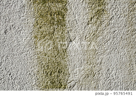 Surface of a concrete wall with green smudges. 95765491