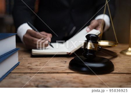 Lawyer businessman working  in office. Businessmen sitting at desk and making notes. 95836925