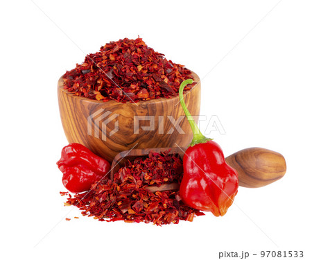 Fresh and dry ground red chili peppers isolated on white background. Capsicum baccatum or Bishop's crown pepper. 97081533